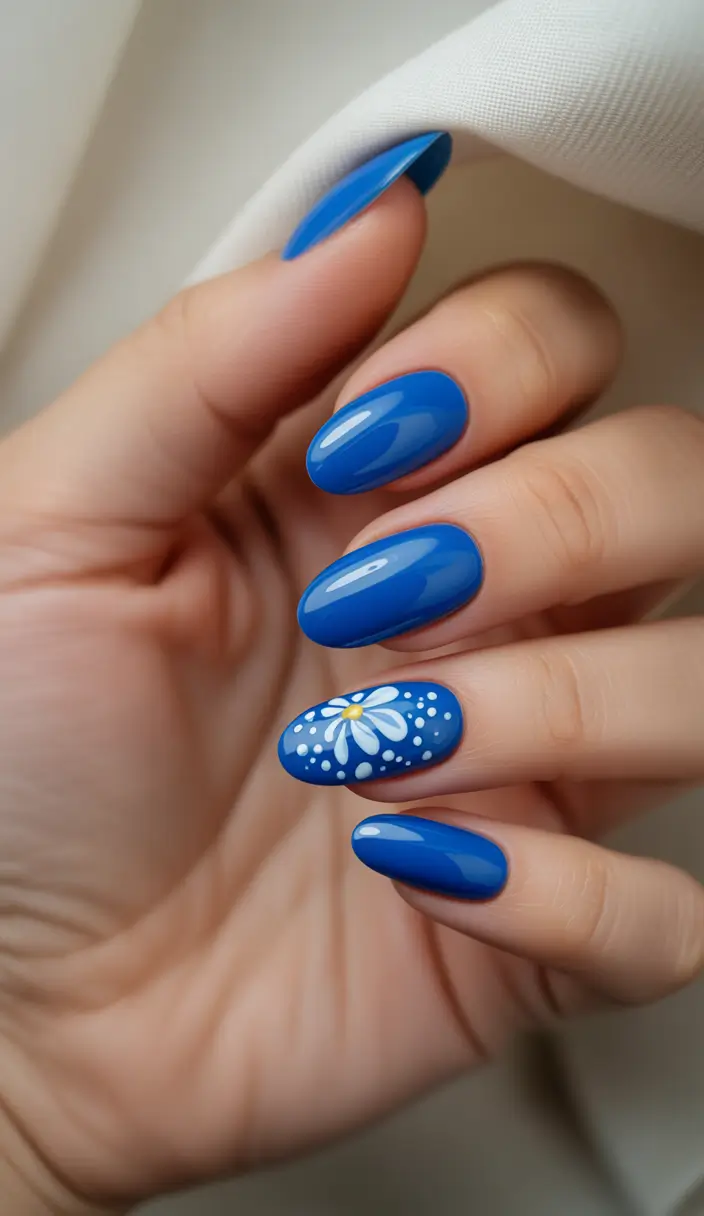 Almond Nails That Slay Summer 2025 - Bold Blue Elegance with a Floral Twist