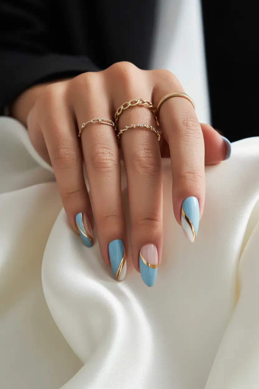 Almond Nails That Slay Summer 2025 Blue and Gold Elegance with a Modern Twist