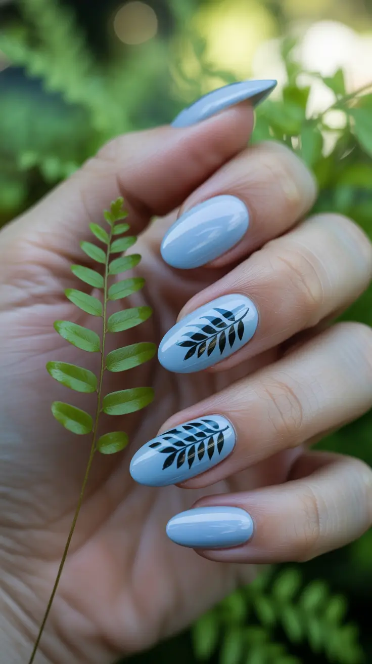 Beach Nails That Shine in Summer 2025 - Sky Blue and Black Botanical Accents