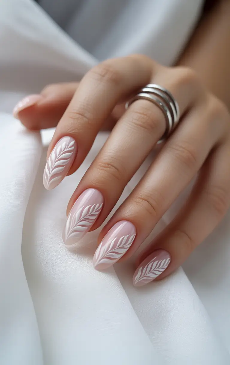 Chic Acrylic Nail Ideas for Summer 2025 Elegant White Leaf Design on Nude Base