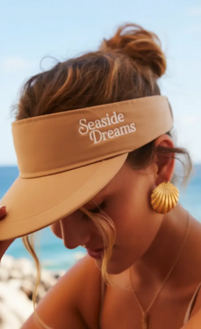 Effortless Pool Day Hairstyles - Simple Summer 2025 Looks Visor Chic Low Knot