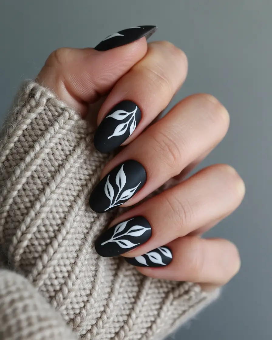 dark fall nails 2025 Minimalist White Leaves on Matte Black