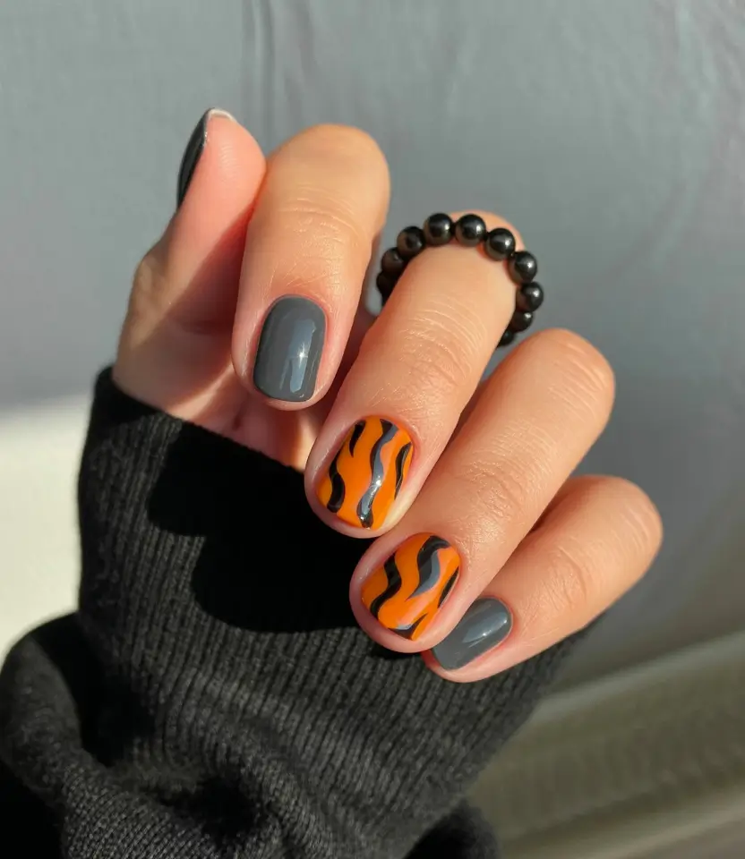 Fall 2025 nail trends Graphic Stripes in Orange and Gray
