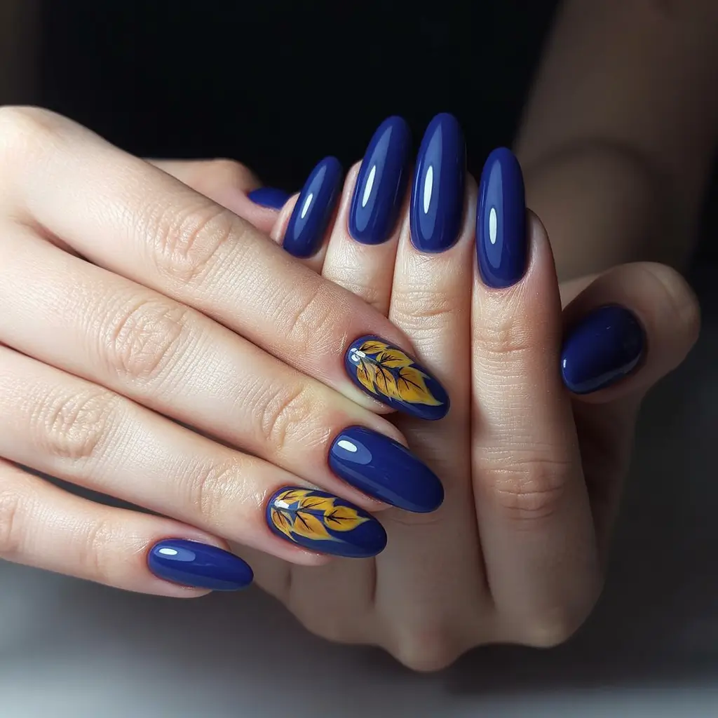fall season nails ideas 2025 - Cobalt Almond with Golden Leaf Accent