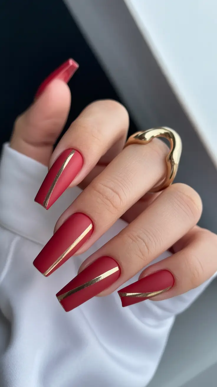 red fall nails 2025 Matte Crimson with Gold Lines