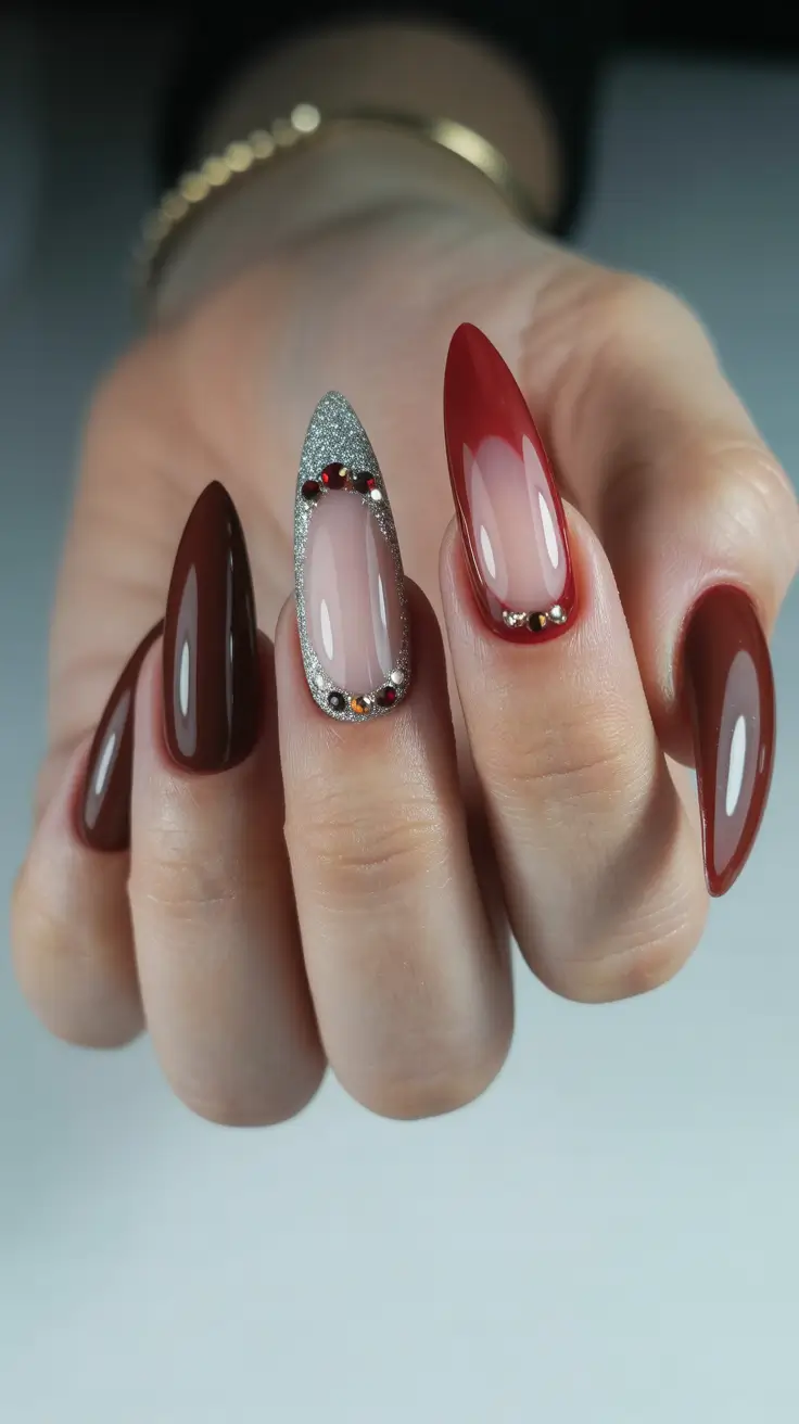 Stylish Red Manicure Winter 2025-2026 with sparkly accent and gem details