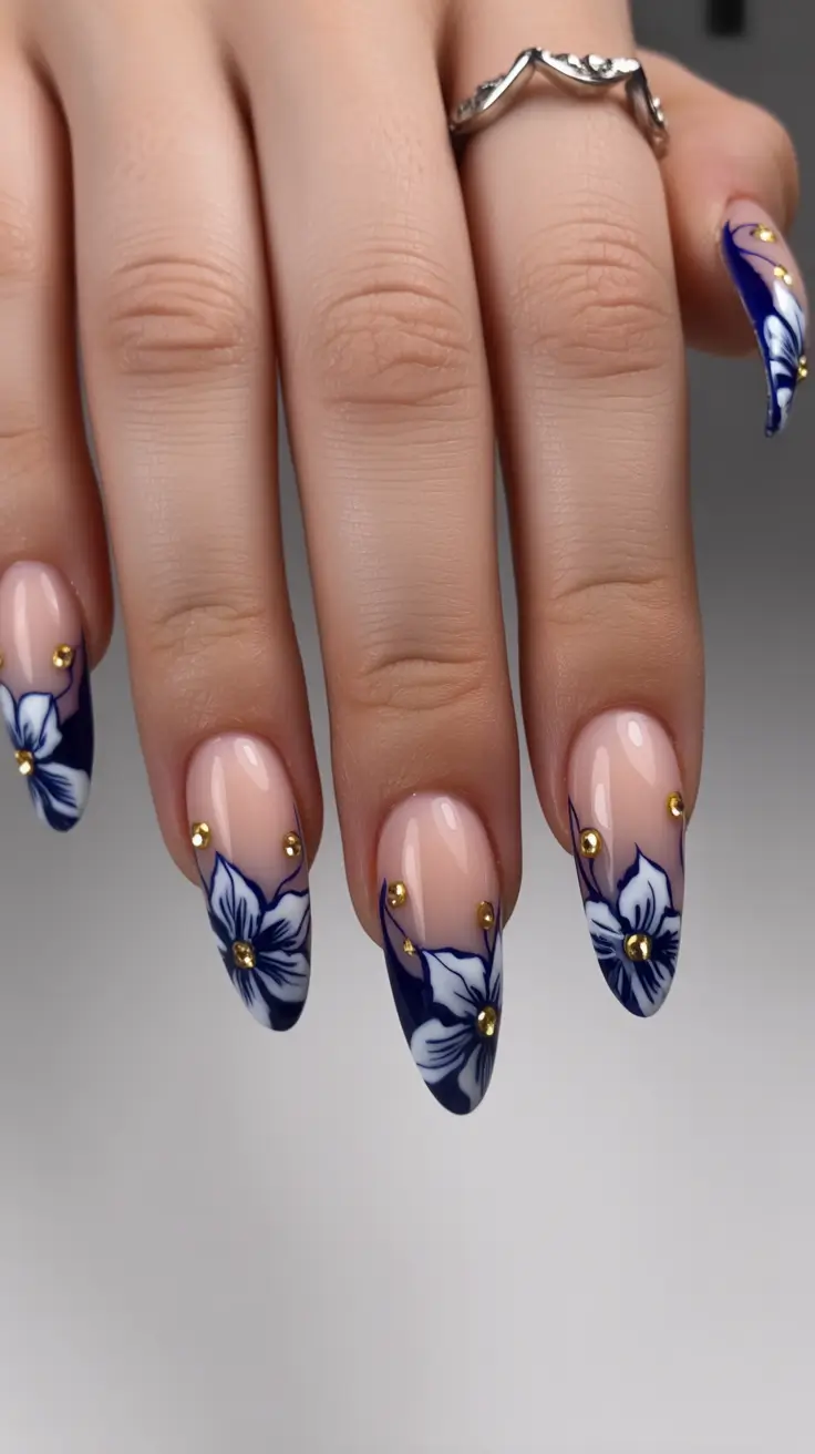 birthday nails 2026 Blue Floral Almond Nails with a Romantic Edge