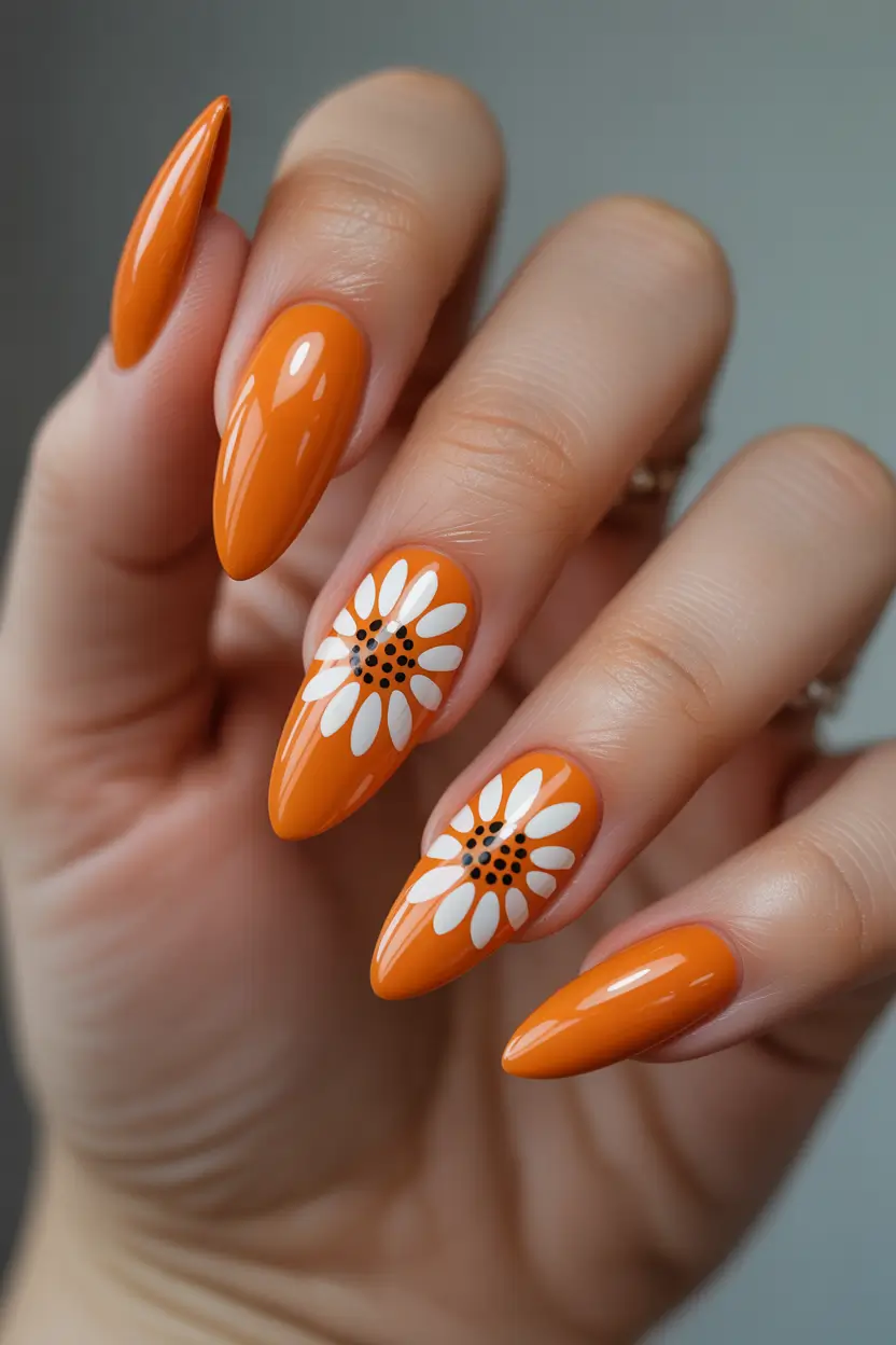 Stylish Spring Nails Simple 2026 Bright Orange Almond Nails with Daisy Details