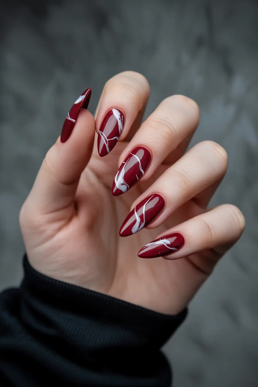 spring nail colors 2026 Wine Red Marble Waves With Glossy Depth