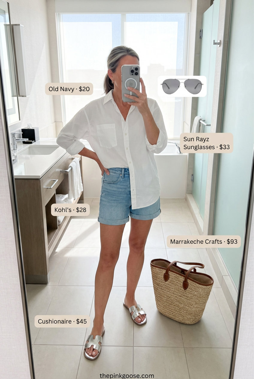 Relaxed fit denim shorts with an oversized white button-down shirt and metallic slide sandals, creating effortless summer 2026 outfits for women over 50 for a resort getaway.