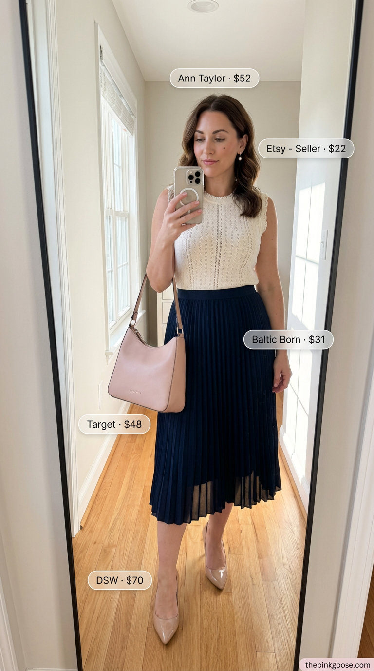 Summer Work Outfits 2026: Effortless Pleated Midi Skirt Elegant summer work outfit for women 2026: navy pleated midi skirt, blush pink knit top, nude block-heel pumps, and a navy shoulder bag for a chic office look.