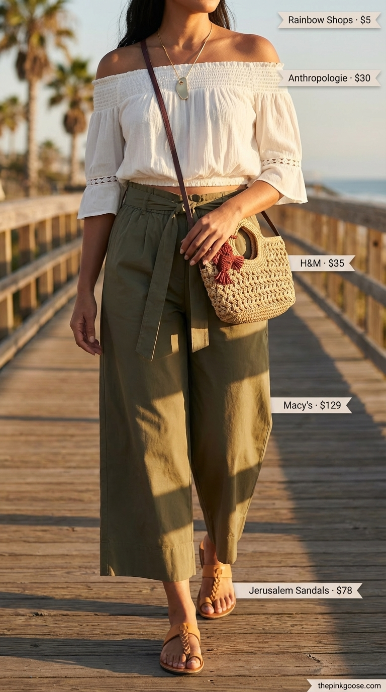 Relaxed cream linen off-shoulder smocked crop top with olive green wide-leg trousers, a chic option for summer off-shoulder outfits for women 2026. Styled with braided sandals and a delicate necklace for a coastal sundowner.