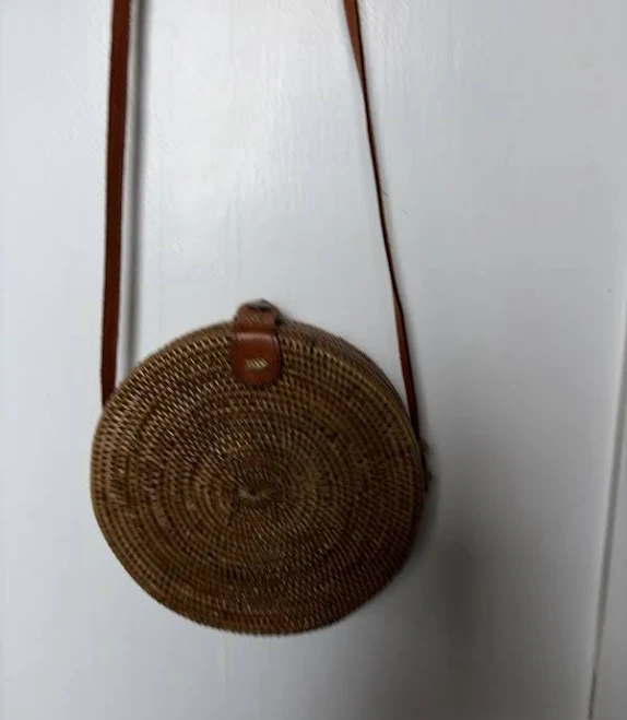 Woven crossbody bag with tassel detail