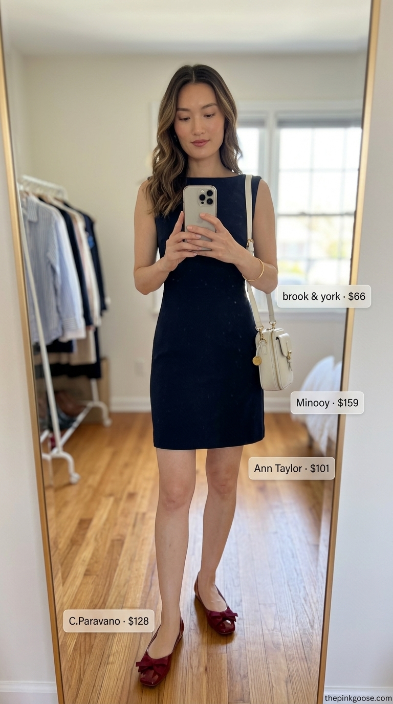 Navy A-line sleeveless mini dress with red ballet flats, gold bracelet, and white crossbody for a chic Parisian cafe look 2026.