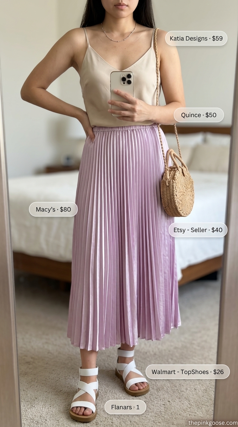 Dreamy lakeside picnic outfit with lavender pleated midi skirt, white camisole, and beige straw bag. Summer pleated skirt outfits 2026.