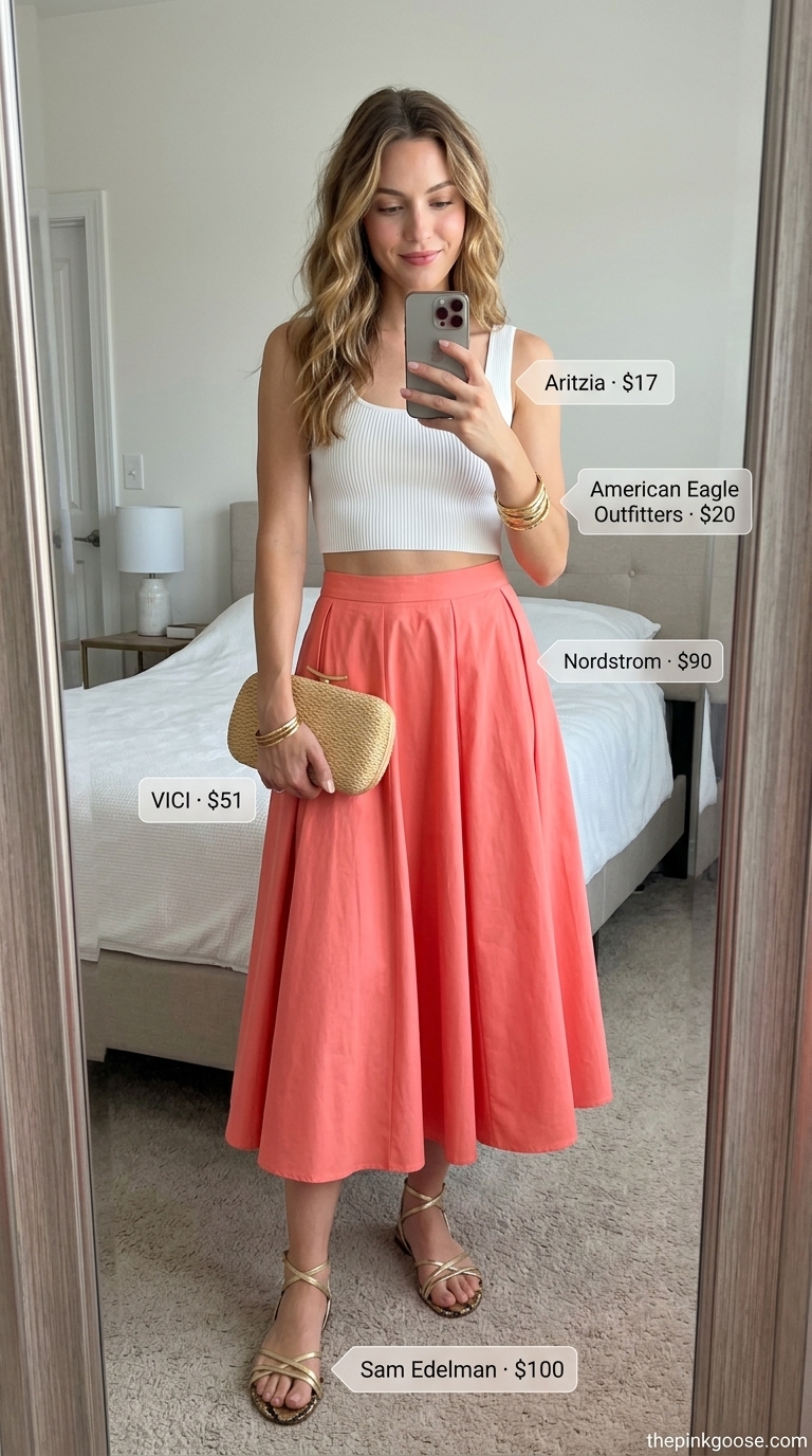 Sunset breeze coral skirt outfit for women 2026: coral midi skirt, white tank, gold sandals, straw clutch, gold bangles.