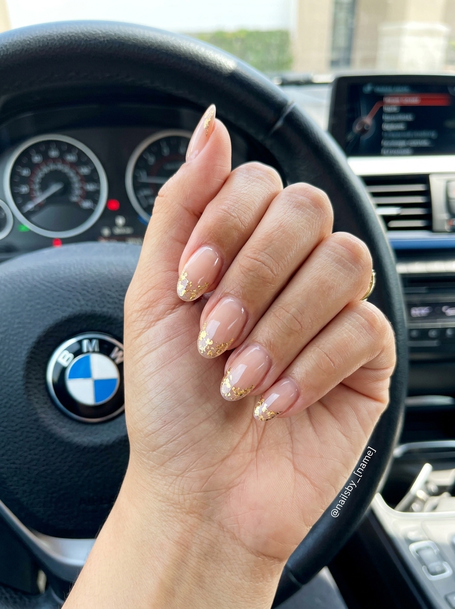 Elegant golden hour foil flake French tip oval nails for formal events and date nights. French manicure summer 2026.