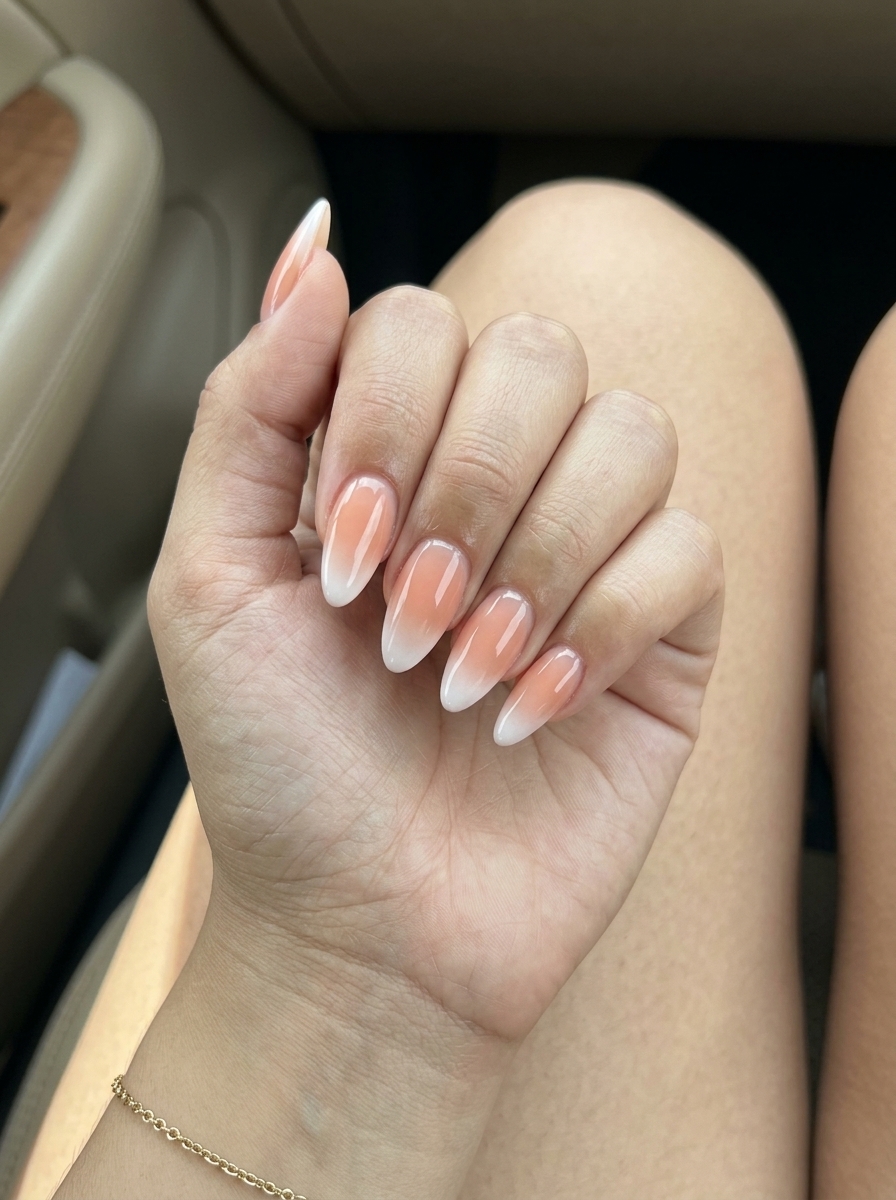 Romantic peachy jelly ombre French tip almond nails for weddings and summer vacations. French manicure summer 2026.