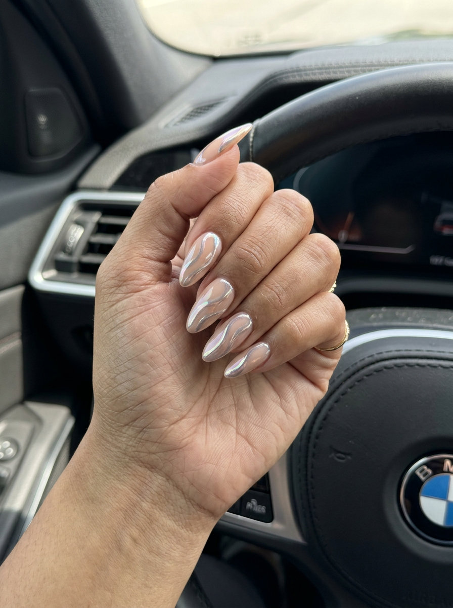 Chrome Swirl Almond Nails 2026: Futuristic Chic Futuristic chrome swirl almond nails for trending summer nails 2026. Chic, polished date night style.