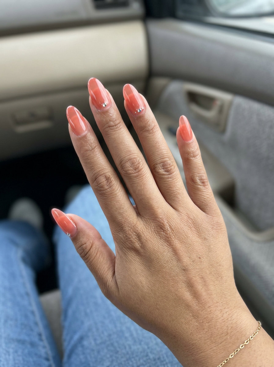Coral Rhinestone Oval Nails 2026 | Party Glam Sparkling coral oval nails with rhinestones 2026 for all skin tones. Glamorous for parties & summer weddings.