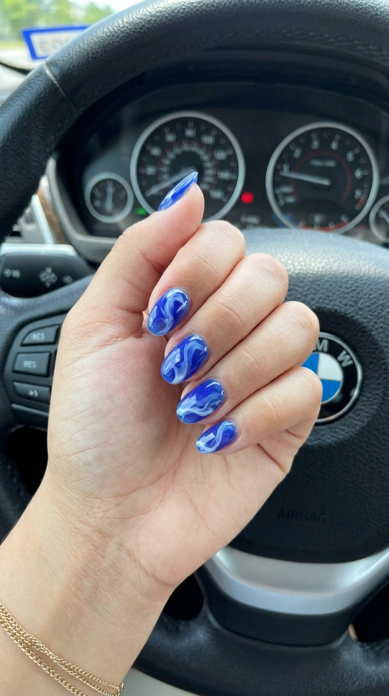 Short Oval Summer Nails 2026: Berry Swirl Short oval summer nails 2026: Summer berry swirl with translucent blueberry and milky white for playful vibes.
