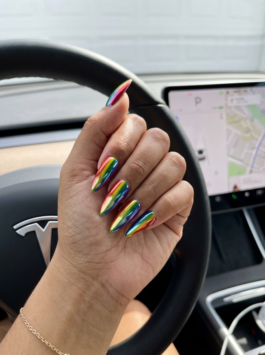 Vibrant chrome rainbow stripes nails 2026 on extra-long stiletto nails for a futuristic look.