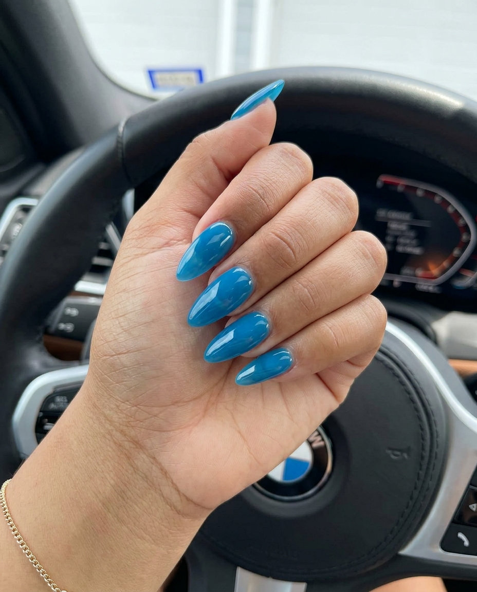 Jelly sky blue almond nails for simple summer nails 2026. Translucent and ultra-glossy vacation style.