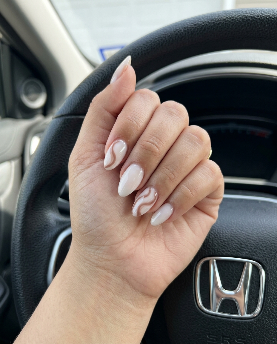 Milky White Almond Abstract Swirls nails for simple vacation nails 2026, bohemian and artistic for festivals.