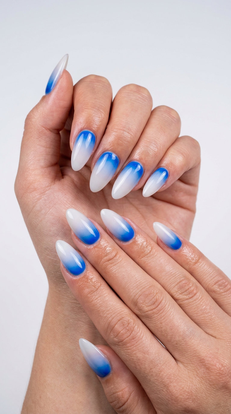 Electric Blue Aura Nails 2026: Festival Ready Electric blue aura almond nails for solid summer nails 2026. Futuristic and ethereal for festivals.