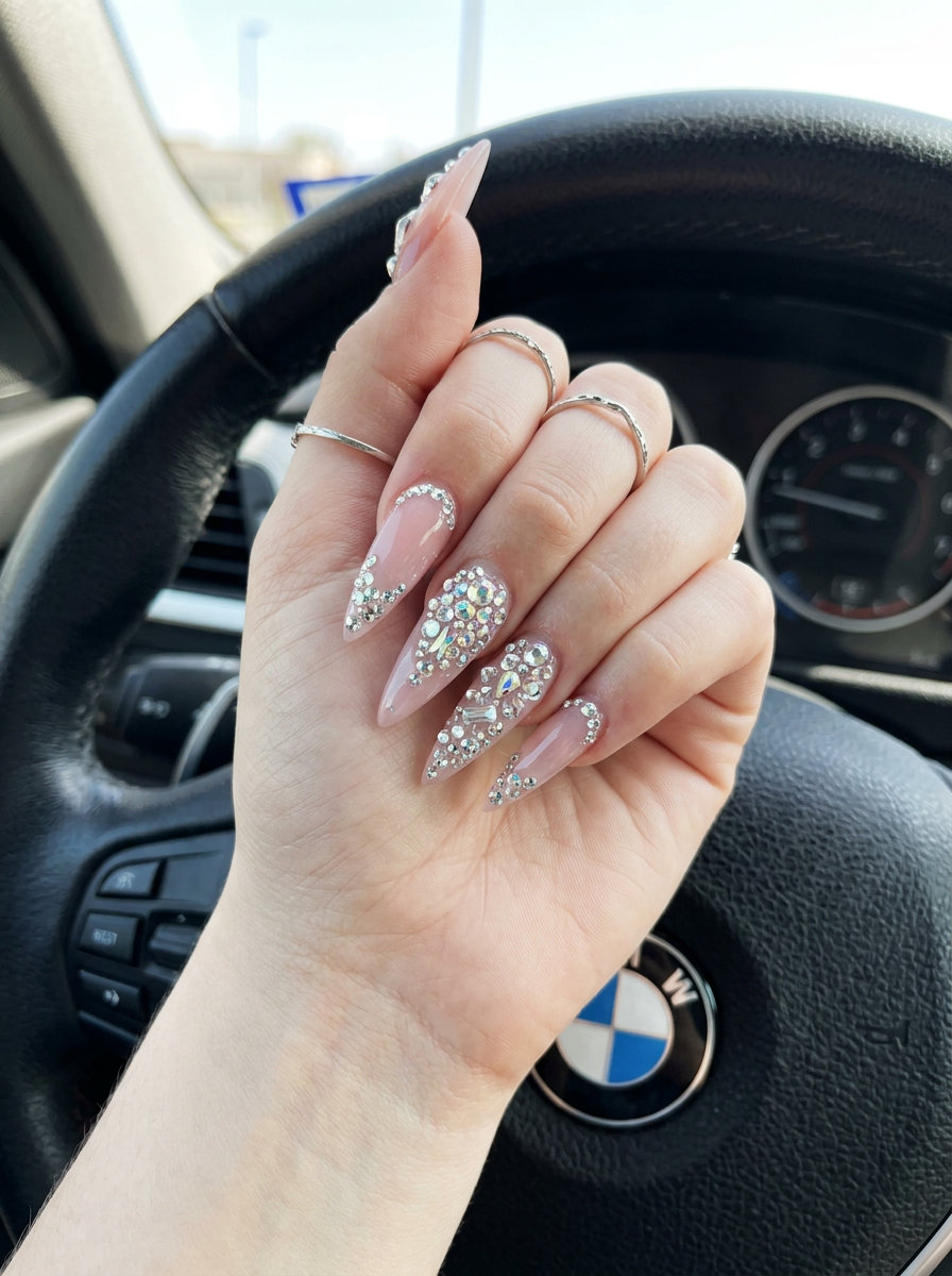 Glamorous 3D crystal cascade stiletto nails for summer parties 2026. Dazzling and luxurious.