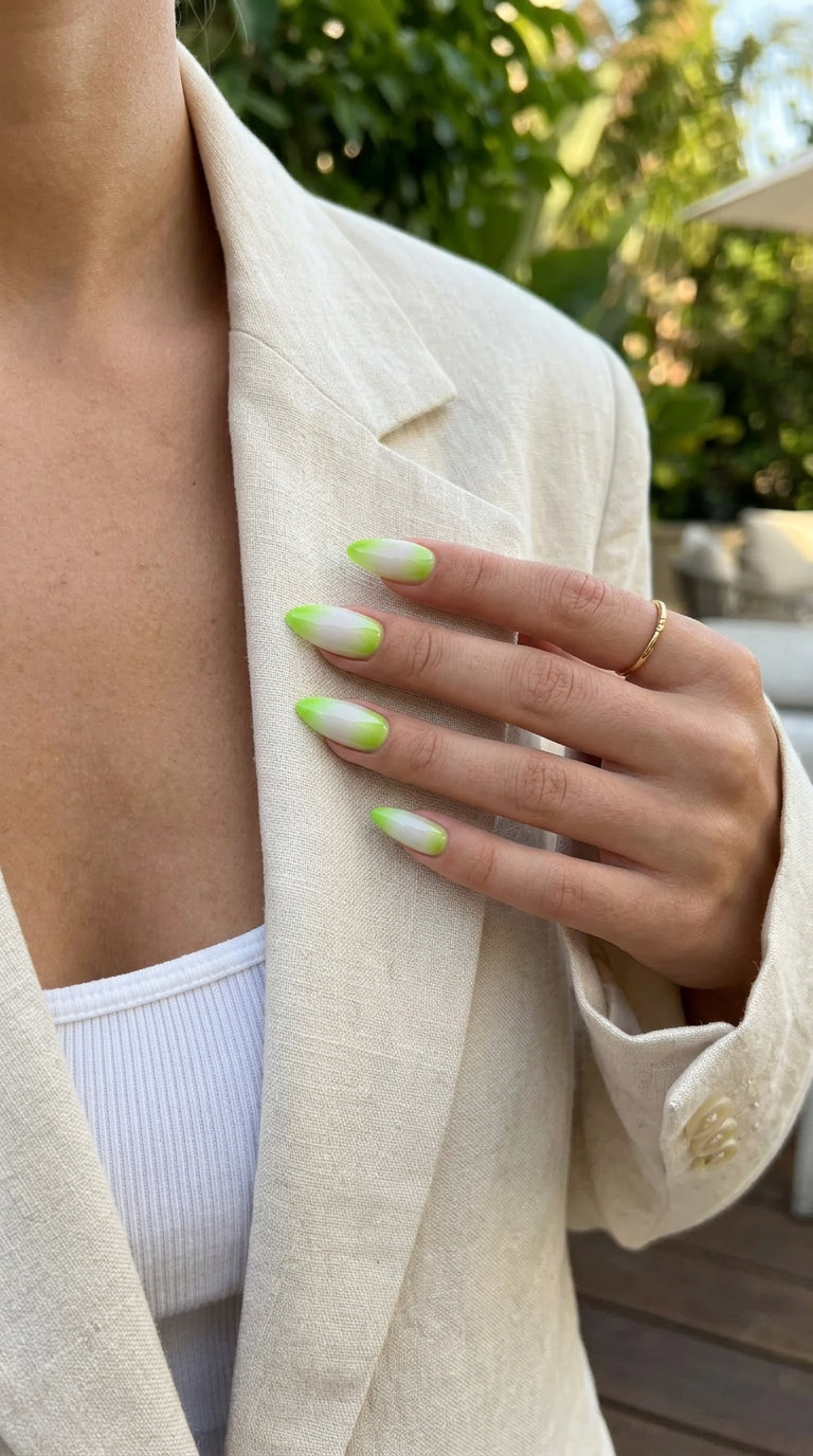Fresh lime green aura stiletto nails with a sheer white base. Stiletto summer nails 2026.