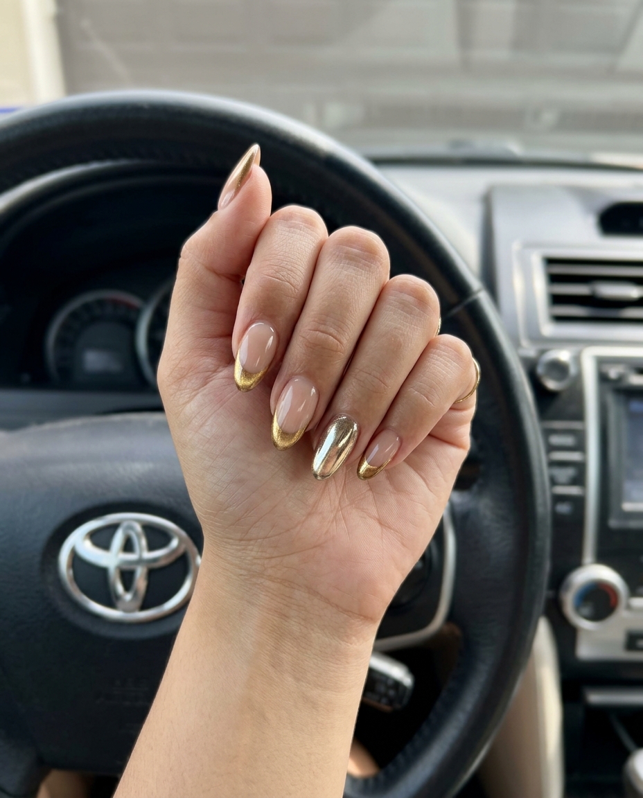 Gold Chrome Cat Eye French Accent: Glamorous event nails with nude base and metallic gold cat eye French tips.