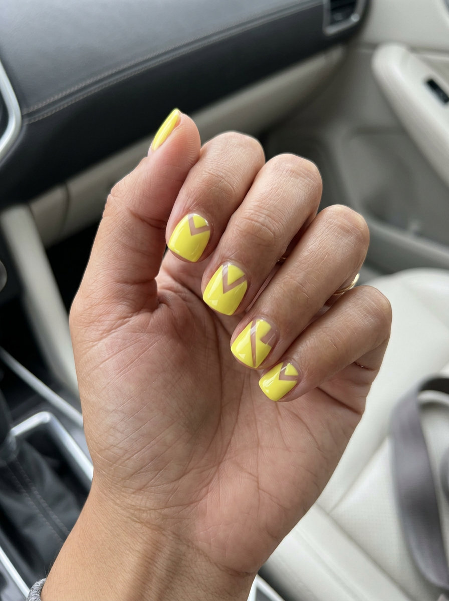 Lemon Yellow Negative Space Geometry - Summer Citrus Nail Art 2026 Lemon Yellow Negative Space Geometry nails for summer citrus nail art 2026. Chic yellow geometric shapes for daily wear.