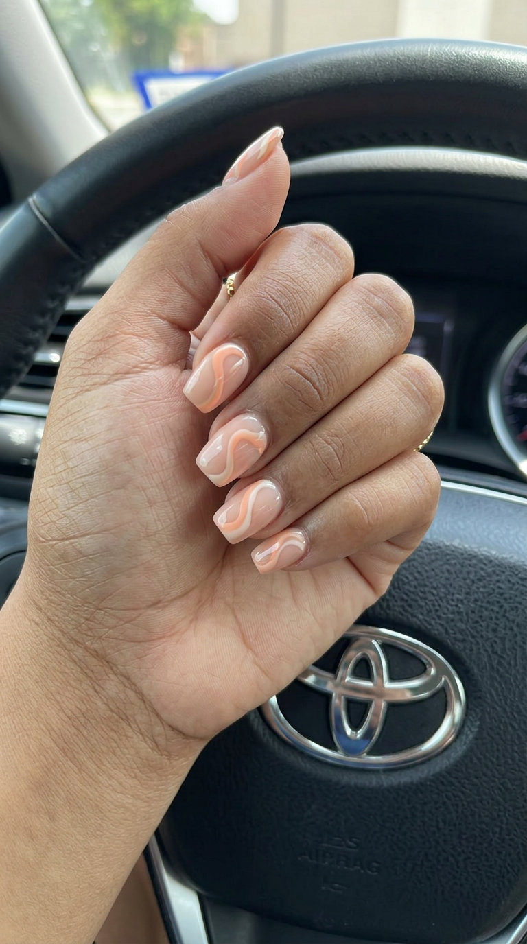 Peachy Abstract Swirl Squoval nails: playful artistic for casual outings summer classy nails 2026.