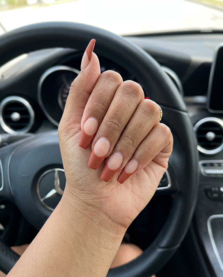 Edgy matte terracotta reverse French nails for parties, festivals, and casual outings. Summer matte nails 2026.