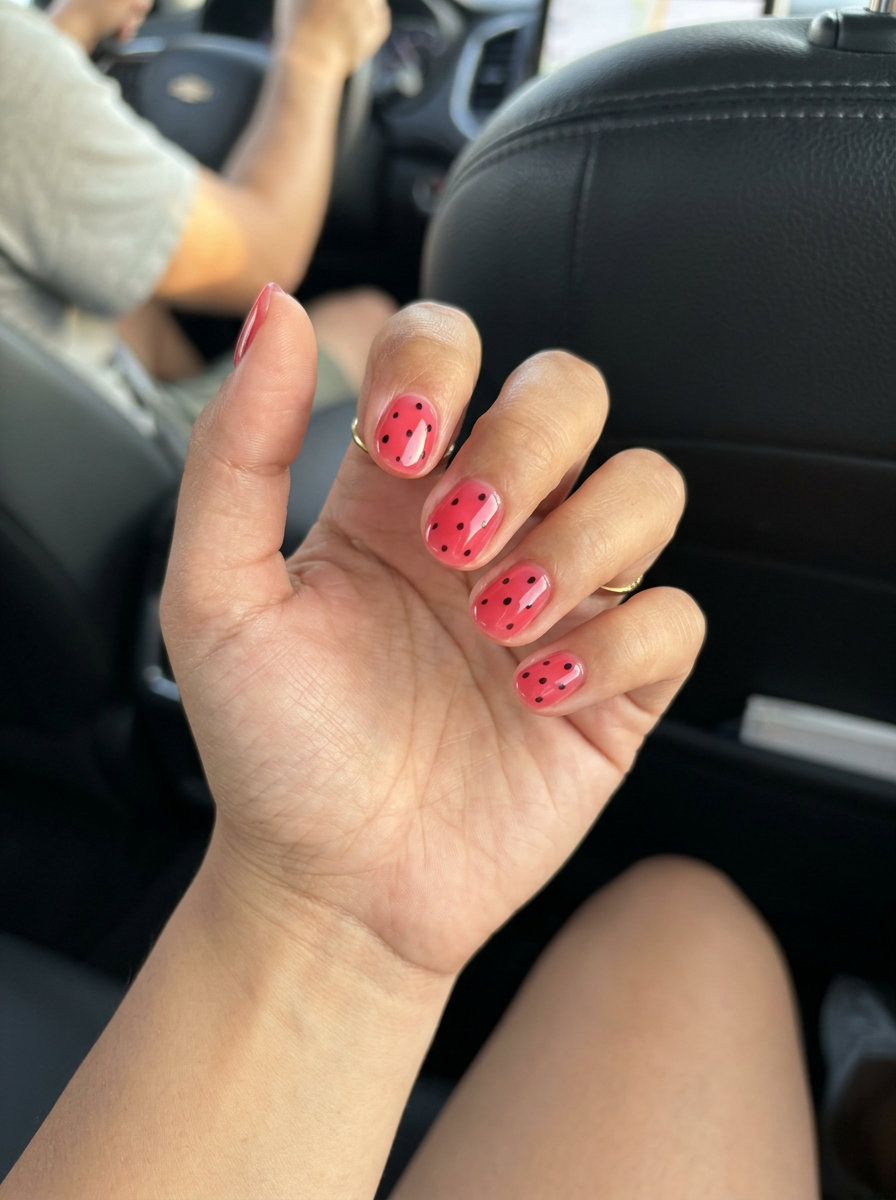 Watermelon Pink Jelly Dots 2026: Playful Juicy watermelon pink jelly nails with black dots for playful style. Summer nail colors 2026.