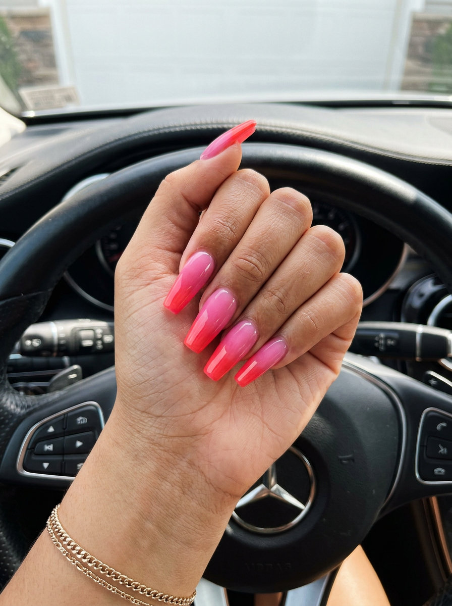 Vivid Coral Glossy French nails: bold coral tips on nude. Summer nails colors 2026 for parties and casual outings.