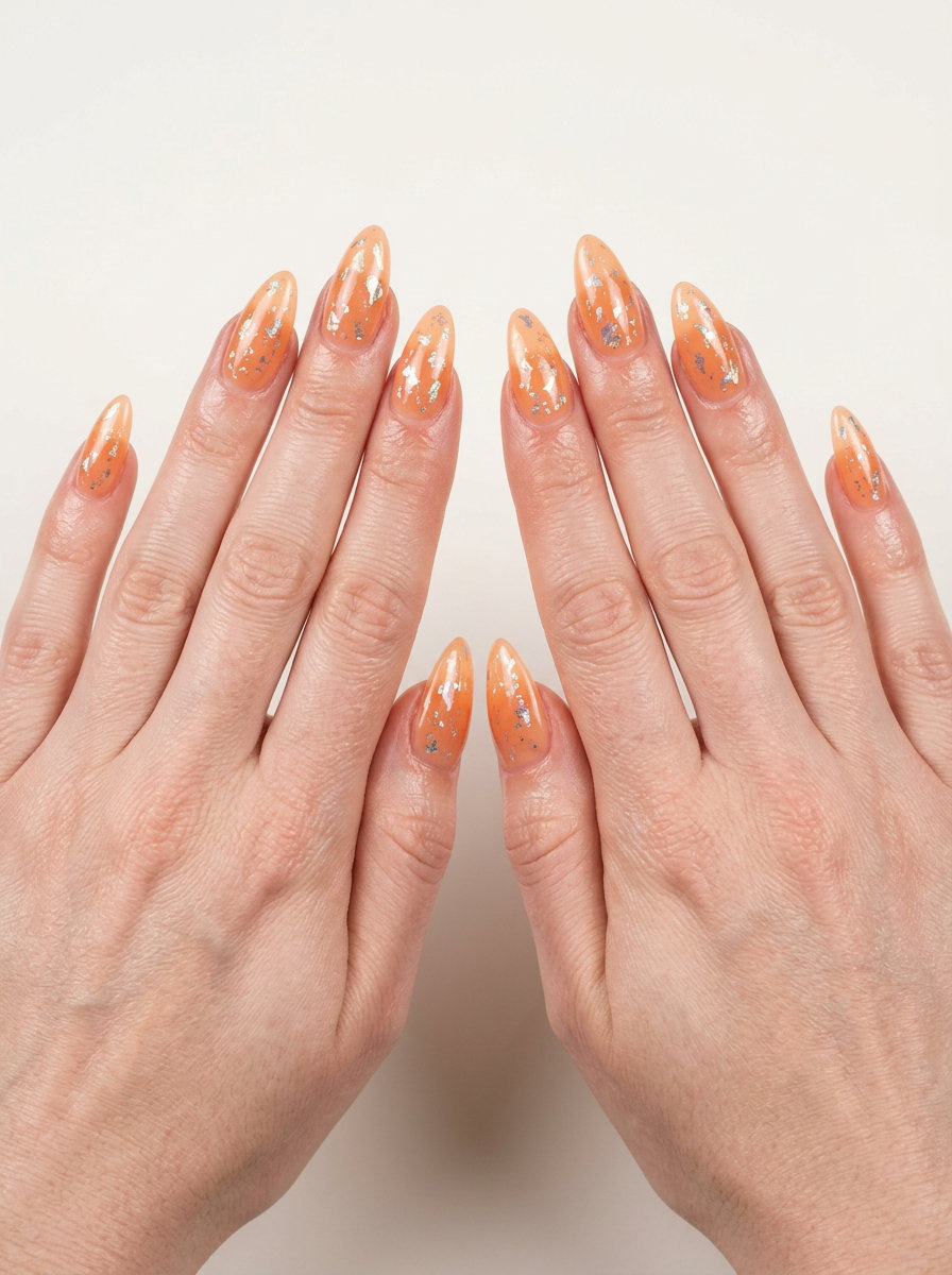 Peach Fuzz Foil Flake Nails 2026 Peach fuzz abstract foil flakes nails for summer 2026, perfect for festivals and vacation. Bohemian and shimmery.