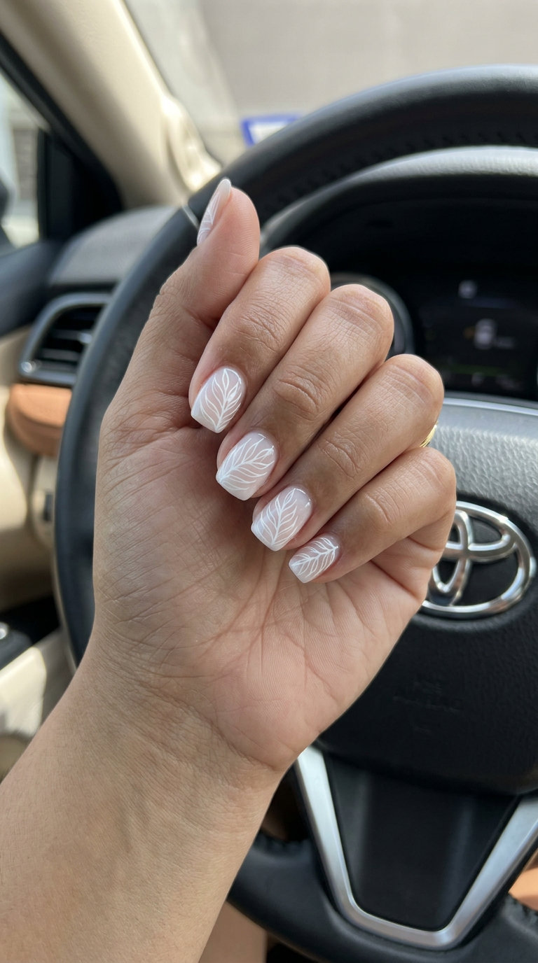 Minimalist white tropical outline negative space nails for daily wear. Tropical nail designs 2026.