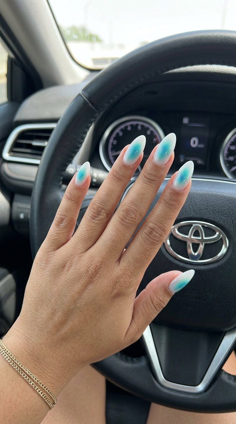Mystic aura turquoise almond nails for a serene date night. Tropical nail designs 2026.