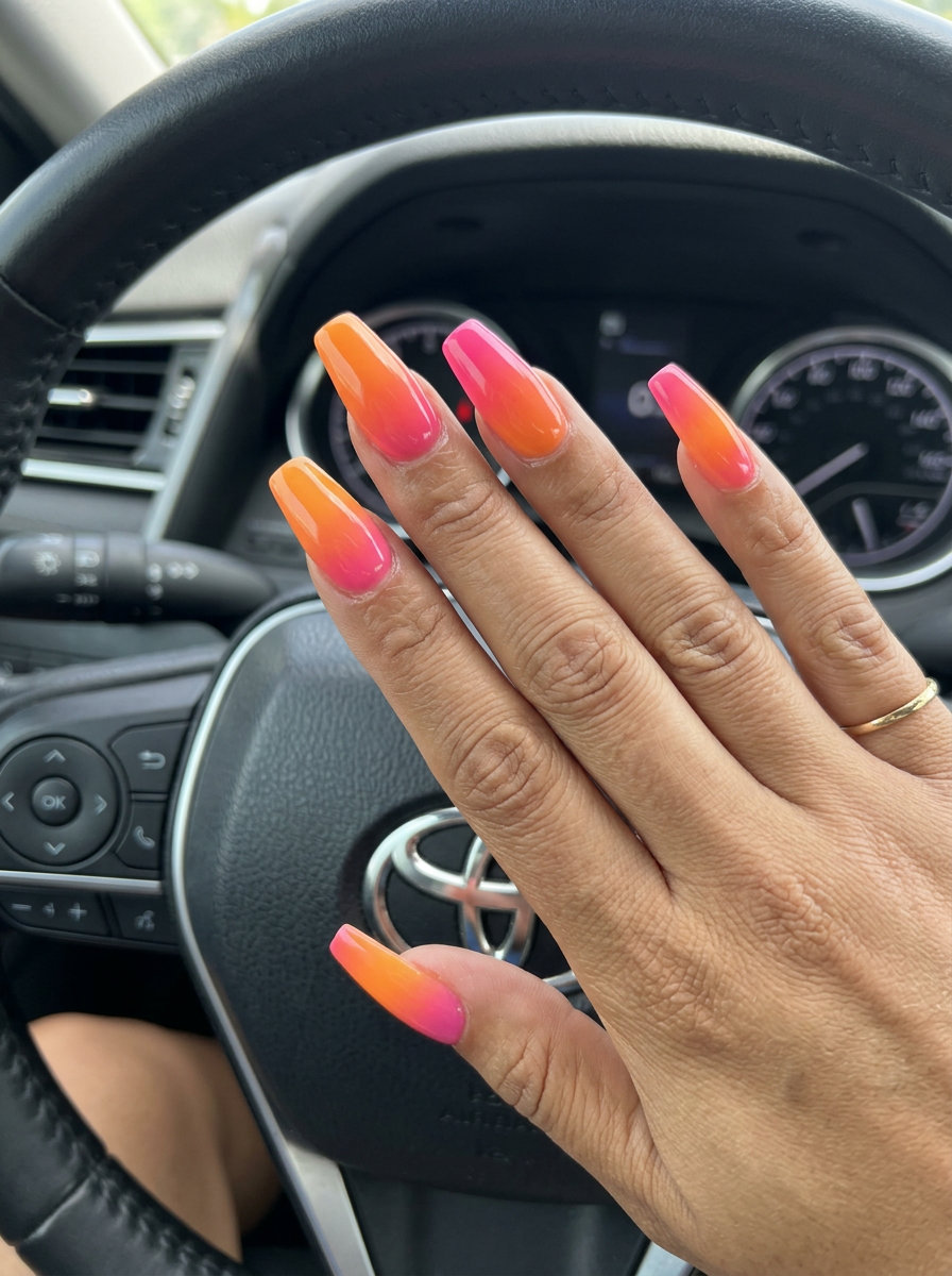 Tropical sunset gradient coffin nails for an evening event. Tropical nail designs 2026.
