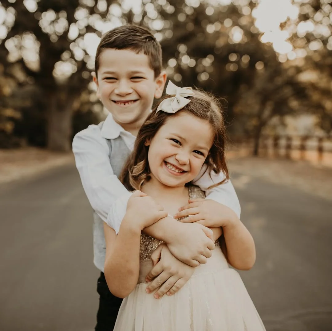 beautiful fall family picture outfits 2026 Cream and Soft Sparkle for Sibling Portraits