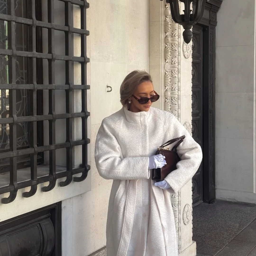 chic fall travel wardrobe for women 2026 Soft Ivory Elegance on Cool Fall Mornings