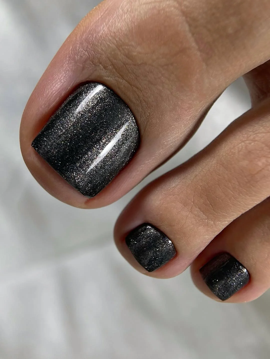 july toe nail colours ideas 2026 Black Chrome Pedicure That Feels Surprisingly Summer-Ready