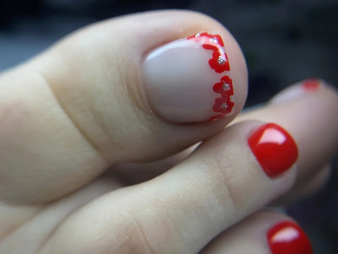 july toe nail colours ideas 2026 Cherry Red Floral Accent with a Romantic Twist