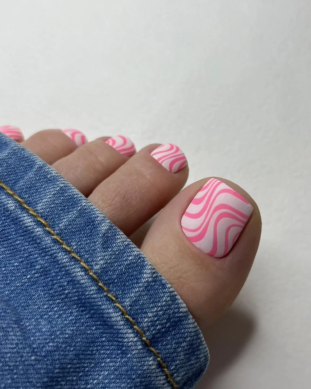 july toe nail colours ideas 2026 Pink Swirl Nail Art for a Playful Summer Statement