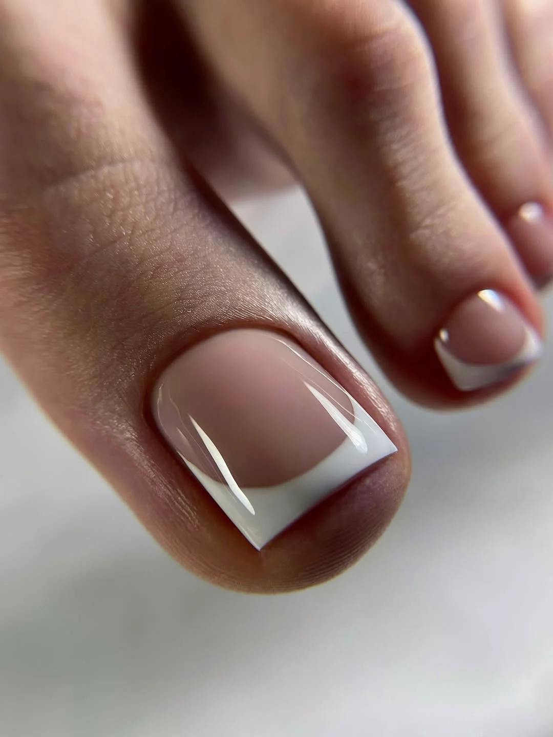 july toe nail colours ideas 2026 Clean White French Tip Pedicure