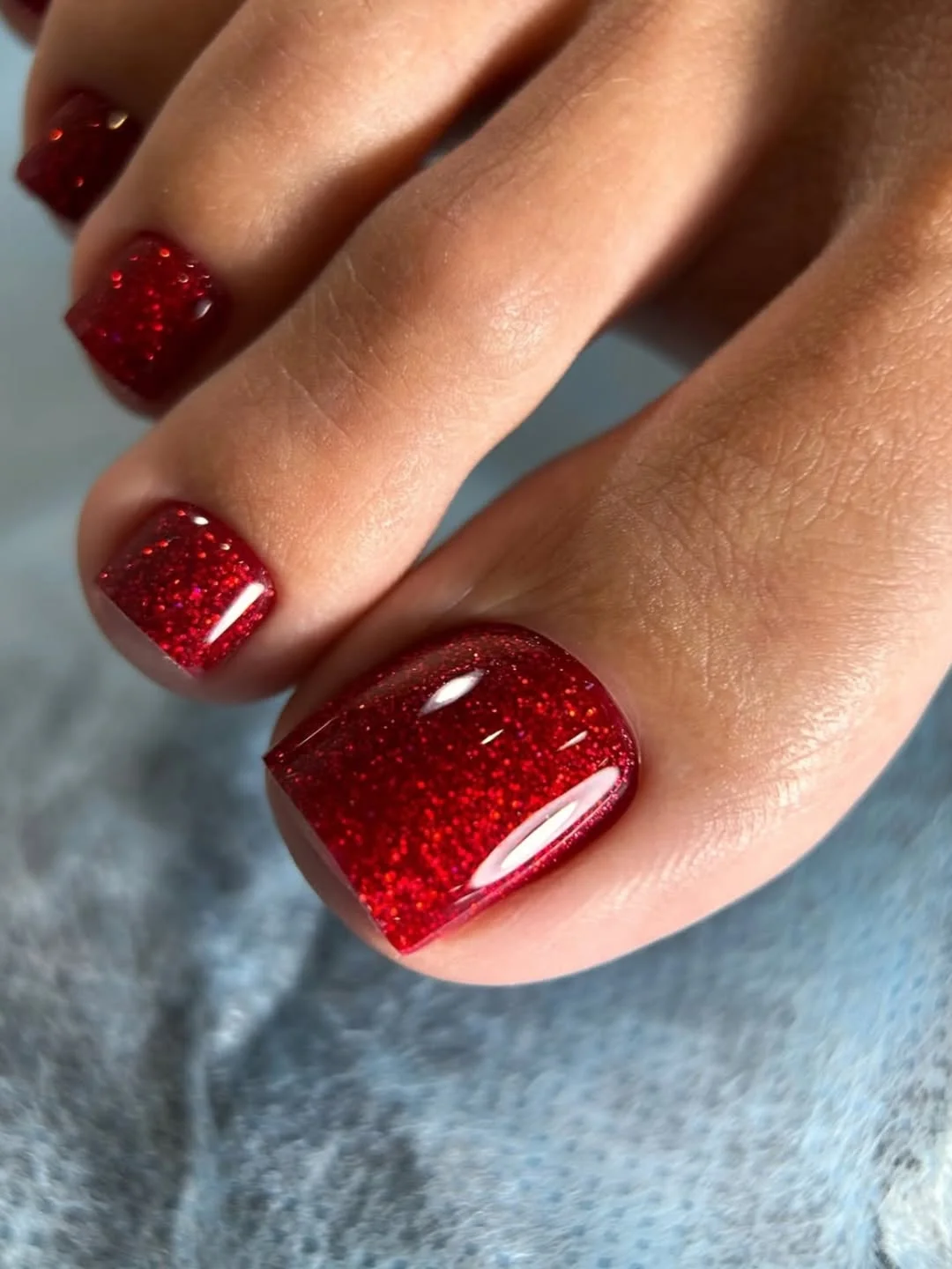 june pedicure ideas 2026 Ruby Red Glitter That Steals the Spotlight
