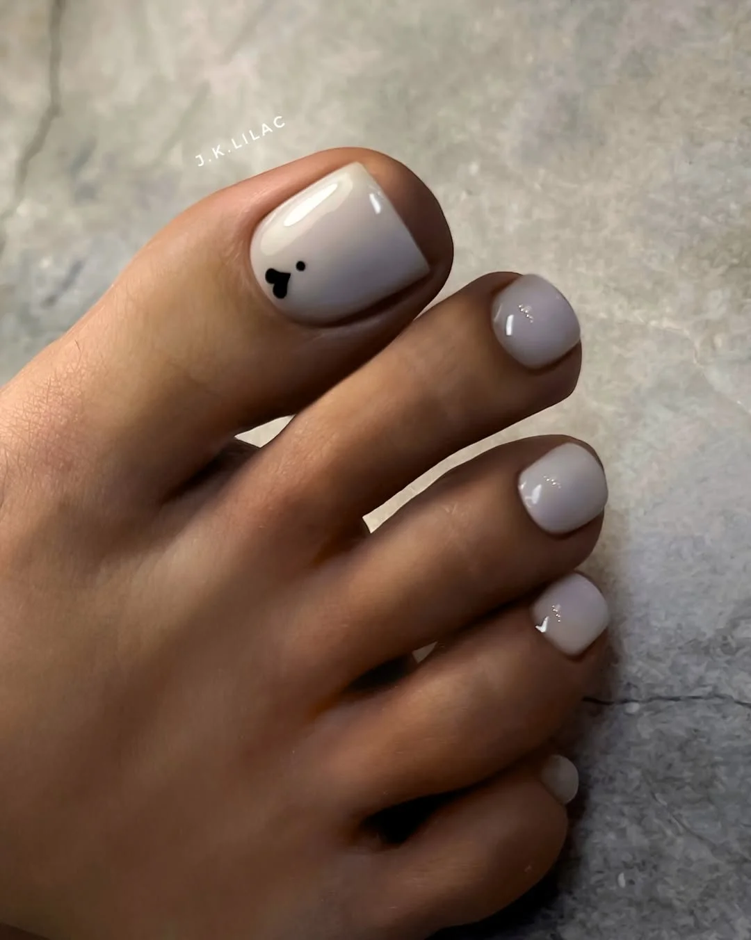 june pedicure ideas 2026 Minimal Heart Accent on Soft Neutral Nails
