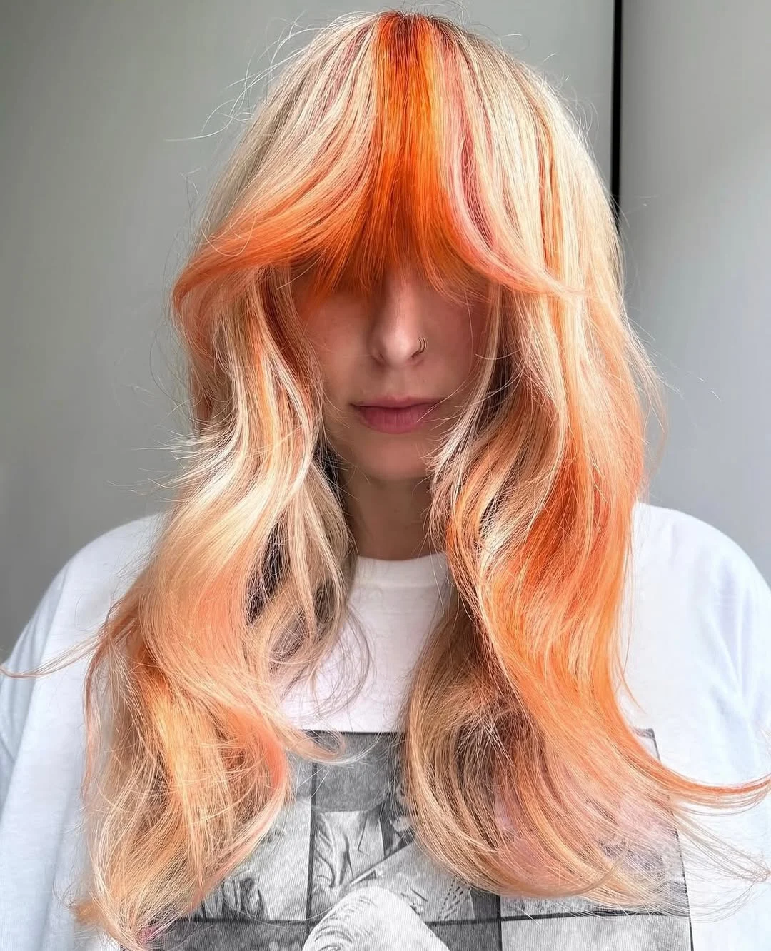 modern july hair colour ideas 2026 Sunset Peach Ribbon Layers
